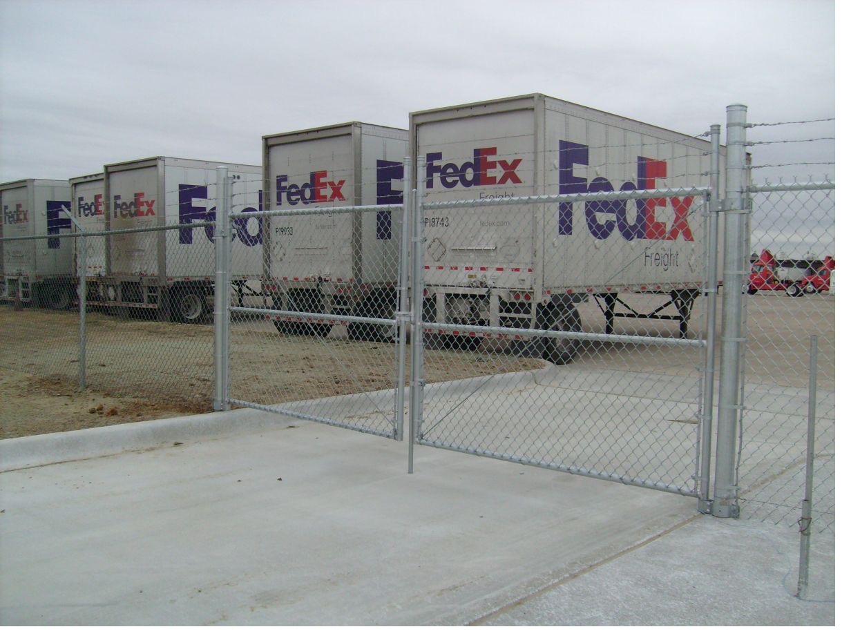 Wide chain link cantilever gates at a freight yard