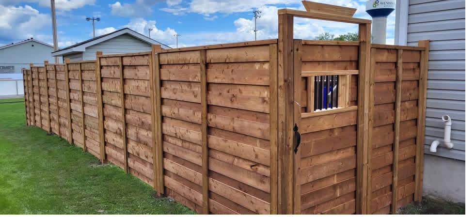 Horizontal wood fence with custom gate
