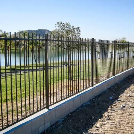 Iron on retaining wall, lakeside