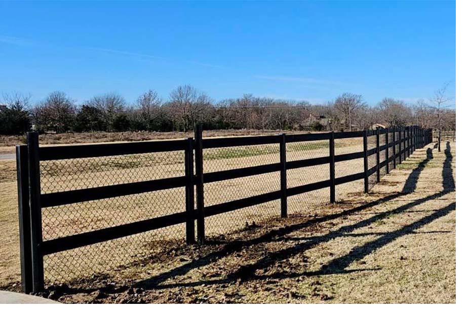Black pipe rail ranch fencing