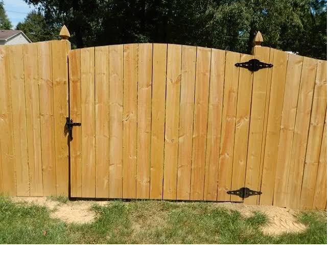 Arched cedar gate, decorative hinges